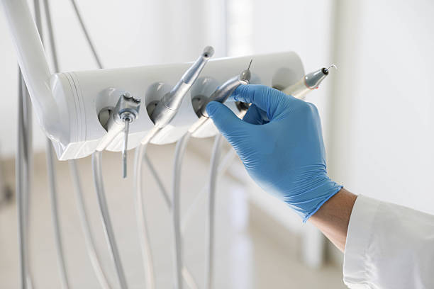 Professional Tooth Extraction technician working in Scotts Hill, TN